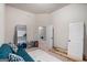 Neutral bedroom featuring a vaulted ceiling, plush carpet, and a doorway to an adjoining room at 121 Amelia Way, Ellenwood, GA 30294