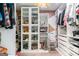 This organized walk-in closet has custom shelves for shoes and purses, including a chandelier at 121 Amelia Way, Ellenwood, GA 30294