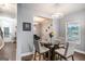 Inviting dining room featuring a modern chandelier and glass table, perfect for Gathering meals at 121 Amelia Way, Ellenwood, GA 30294