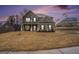 Inviting brick home with a covered porch, perfect for enjoying evenings outdoors at 121 Amelia Way, Ellenwood, GA 30294