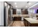 Modern kitchen with stainless steel appliances, granite counters, and ample storage at 121 Amelia Way, Ellenwood, GA 30294