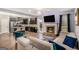Spacious living room with modern fireplace and open concept to kitchen at 121 Amelia Way, Ellenwood, GA 30294
