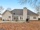 Spacious backyard featuring a patio with a grill, table, chairs, and a chimney at 506 Olivia Ct, Stockbridge, GA 30281