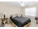 Bedroom features natural light from the window, ceiling fan, and neutral tones at 506 Olivia Ct, Stockbridge, GA 30281
