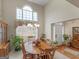 Inviting dining area with natural light, chandelier, and ample space for entertaining at 506 Olivia Ct, Stockbridge, GA 30281