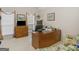 Home office with a desk, cabinetry, and comfortable seating at 506 Olivia Ct, Stockbridge, GA 30281
