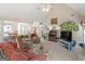 Comfortable living room with open floor plan, vaulted ceiling and seamless flow to dining area at 506 Olivia Ct, Stockbridge, GA 30281