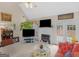 Cozy living room with fireplace, vaulted ceiling and seamless flow to outdoor living space at 506 Olivia Ct, Stockbridge, GA 30281