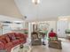 Comfortable living room with open floor plan, vaulted ceiling and seamless flow to dining area at 506 Olivia Ct, Stockbridge, GA 30281