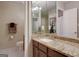 Bathroom featuring granite countertops, a large mirror, a tiled floor, and modern fixtures at 2119 Pine Heights Ne Dr, Atlanta, GA 30324