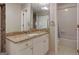 Updated bathroom featuring granite countertops, white cabinets, and tiled floors at 2119 Pine Heights Ne Dr, Atlanta, GA 30324