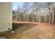 Expansive backyard with mature trees, offering a serene and private outdoor space at 417 River Trace Dr, Villa Rica, GA 30180