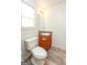 Bathroom with a toilet, sink, and wood look flooring at 417 River Trace Dr, Villa Rica, GA 30180