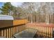 Cozy backyard deck perfect for outdoor dining and overlooks a private wooded lot at 417 River Trace Dr, Villa Rica, GA 30180