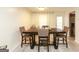 Well-lit dining room featuring a wooden table, chairs, and neutral decor at 417 River Trace Dr, Villa Rica, GA 30180