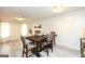 Cozy dining room featuring a wooden table, neutral decor, and ample lighting at 417 River Trace Dr, Villa Rica, GA 30180