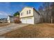 Charming two-story home featuring an attached two-car garage and a well-maintained front lawn at 417 River Trace Dr, Villa Rica, GA 30180