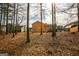 Back of home with wooded lot; property has mature trees and is surrounded by nature at 417 River Trace Dr, Villa Rica, GA 30180