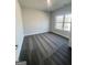 Comfortable bedroom with neutral carpet and a window offering natural light for a cozy atmosphere at 3392 Milan Ct # 2 Plapprox Sqft 3, Douglasville, GA 30135