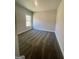 Bedroom featuring plush carpeting, window providing natural light, and fresh, neutral walls for versatile decor at 3392 Milan Ct # 2 Plapprox Sqft 3, Douglasville, GA 30135