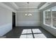 Bright dining room with tray ceiling, wainscoting, and large windows for ample natural light at 3392 Milan Ct # 2 Plapprox Sqft 3, Douglasville, GA 30135