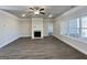 Cozy living room with a fireplace, large windows, and elegant trim for a relaxing atmosphere at 3392 Milan Ct # 2 Plapprox Sqft 3, Douglasville, GA 30135