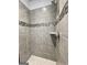 Modern shower with neutral-toned tiles, built-in shelving, and sleek fixtures for a spa-like experience at 3392 Milan Ct # 2 Plapprox Sqft 3, Douglasville, GA 30135