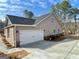 New construction home with white garage door and concrete driveway at 3392 Milan Ct # 2 Plapprox Sqft 3, Douglasville, GA 30135