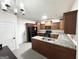 Kitchen featuring dark wood cabinetry, granite countertops, and modern appliances at 2517 Oakleaf Rdg, Lithonia, GA 30058