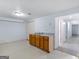 Finished basement area featuring an open doorway, sink with cabinets, and closet at 445 Turner Dr, Mcdonough, GA 30252