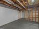 Unfinished basement showcasing painted brick wall, and exposed wood beams at 445 Turner Dr, Mcdonough, GA 30252