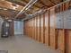 Unfinished basement with exposed ceiling, hot water tank, wood framing, and concrete flooring at 445 Turner Dr, Mcdonough, GA 30252