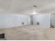 This is a basement living area with carpet at 445 Turner Dr, Mcdonough, GA 30252