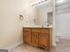 Bathroom vanity with sink and cabinets offering ample storage space, toilet to the right at 445 Turner Dr, Mcdonough, GA 30252