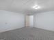 Carpeted bedroom with blue walls has an open doorway to another room at 445 Turner Dr, Mcdonough, GA 30252