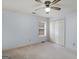 Bedroom featuring a ceiling fan, neutral carpeting, and window at 445 Turner Dr, Mcdonough, GA 30252