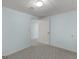 Carpeted bedroom with blue walls has an open doorway to another room at 445 Turner Dr, Mcdonough, GA 30252