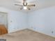 Light blue bedroom with ceiling fan and neutral carpeting at 445 Turner Dr, Mcdonough, GA 30252