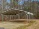 Open metal carport structure, offering shaded parking and protection from the elements at 445 Turner Dr, Mcdonough, GA 30252