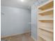 Walk-in closet with wire shelves and built-in bookcase at 445 Turner Dr, Mcdonough, GA 30252