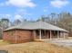 Attractive brick home featuring a classic design and a welcoming red front door at 445 Turner Dr, Mcdonough, GA 30252