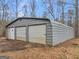 Large metal two car garage, detached, with two roll up doors at 445 Turner Dr, Mcdonough, GA 30252