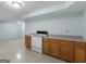 Basement kitchen features wooden cabinets and a white range oven at 445 Turner Dr, Mcdonough, GA 30252