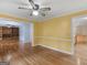 Living room boasting hardwood floors, bright walls, and seamless access to other rooms at 445 Turner Dr, Mcdonough, GA 30252