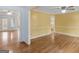 Charming living area with hardwood floors and views into multiple rooms of the home at 445 Turner Dr, Mcdonough, GA 30252