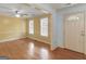 Bright living room with hardwood floors, a ceiling fan, and natural light at 445 Turner Dr, Mcdonough, GA 30252