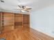 Living room featuring hardwood floors and built-in shelving for storage and display at 445 Turner Dr, Mcdonough, GA 30252