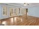 Spacious living room boasts hardwood floors, French doors, and bright natural light at 445 Turner Dr, Mcdonough, GA 30252