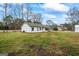 Backyard view of home, showing siding, and mature trees at 225 Highway 212 S, Covington, GA 30014