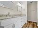 Bathroom features double vanity with granite countertops and tile floor at 225 Highway 212 S, Covington, GA 30014